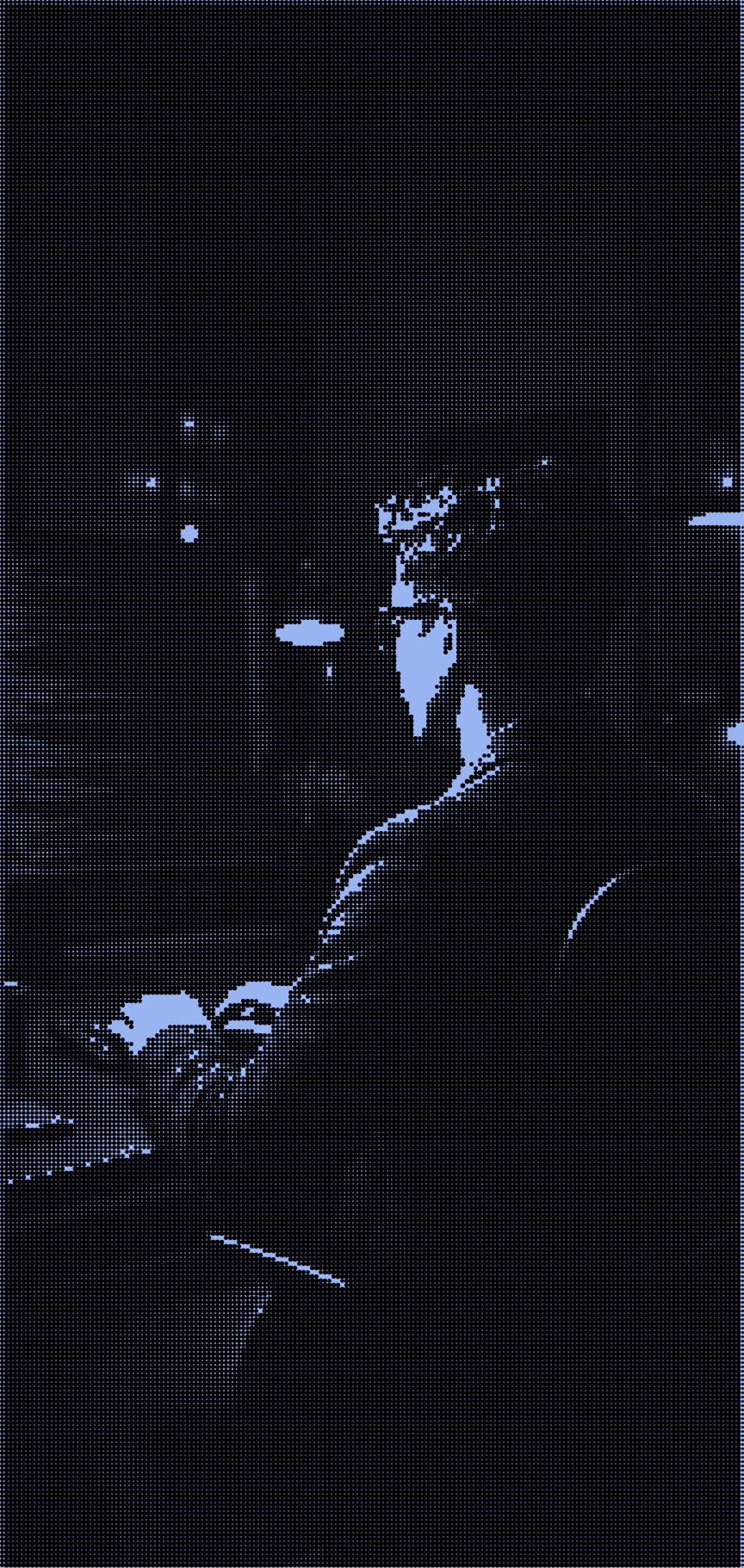 Yumesh Ban coding at an office desk, viewed from behind